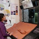 Girl explores the "Surface of Mars" model